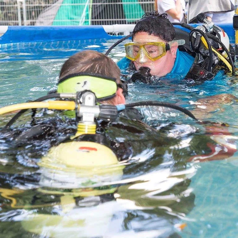 Volunteer worker Rachel Taylor goes underwater with tutor Richard Burke